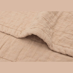 Close up of the Jollein Biscuit jacquard muslin