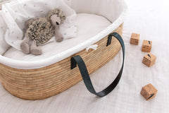 Ko-Coon Timeless moses basket black styled with a liner