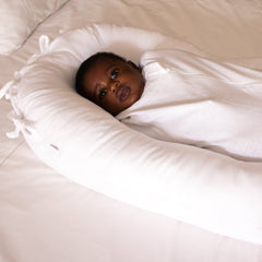 Newborn in the Ko-Coon nesting pod with the tied newborn cover