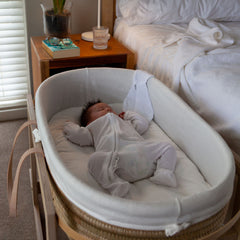 Ko-Coon merino mattress in a Moses basket on a stand