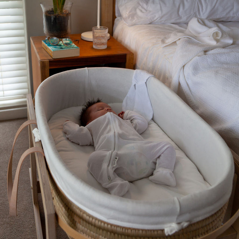 Ko-Coon merino mattress in a Moses basket on a stand