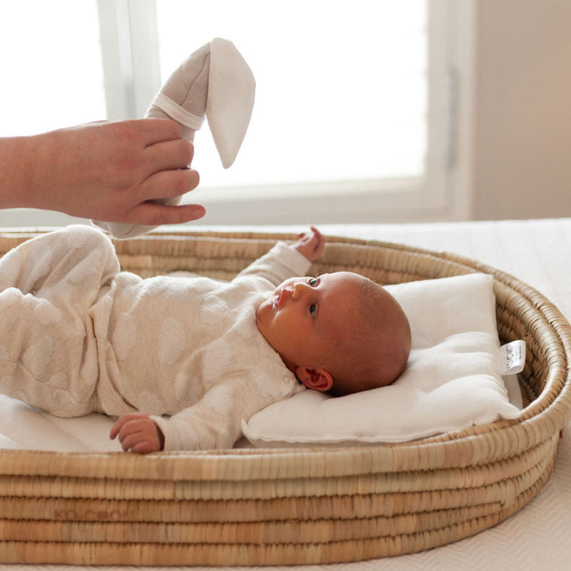 Baby lying in the Ko-Coon changing basket