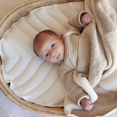 Newborn on the Ko-Coon changing basket padding