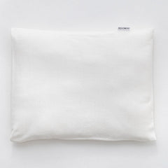 Ko-Coon milky white baby pillowcase on a merino pillow