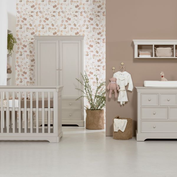 Kidsmill oatmeal shelf mounted above the chest of drawers in a nursery
